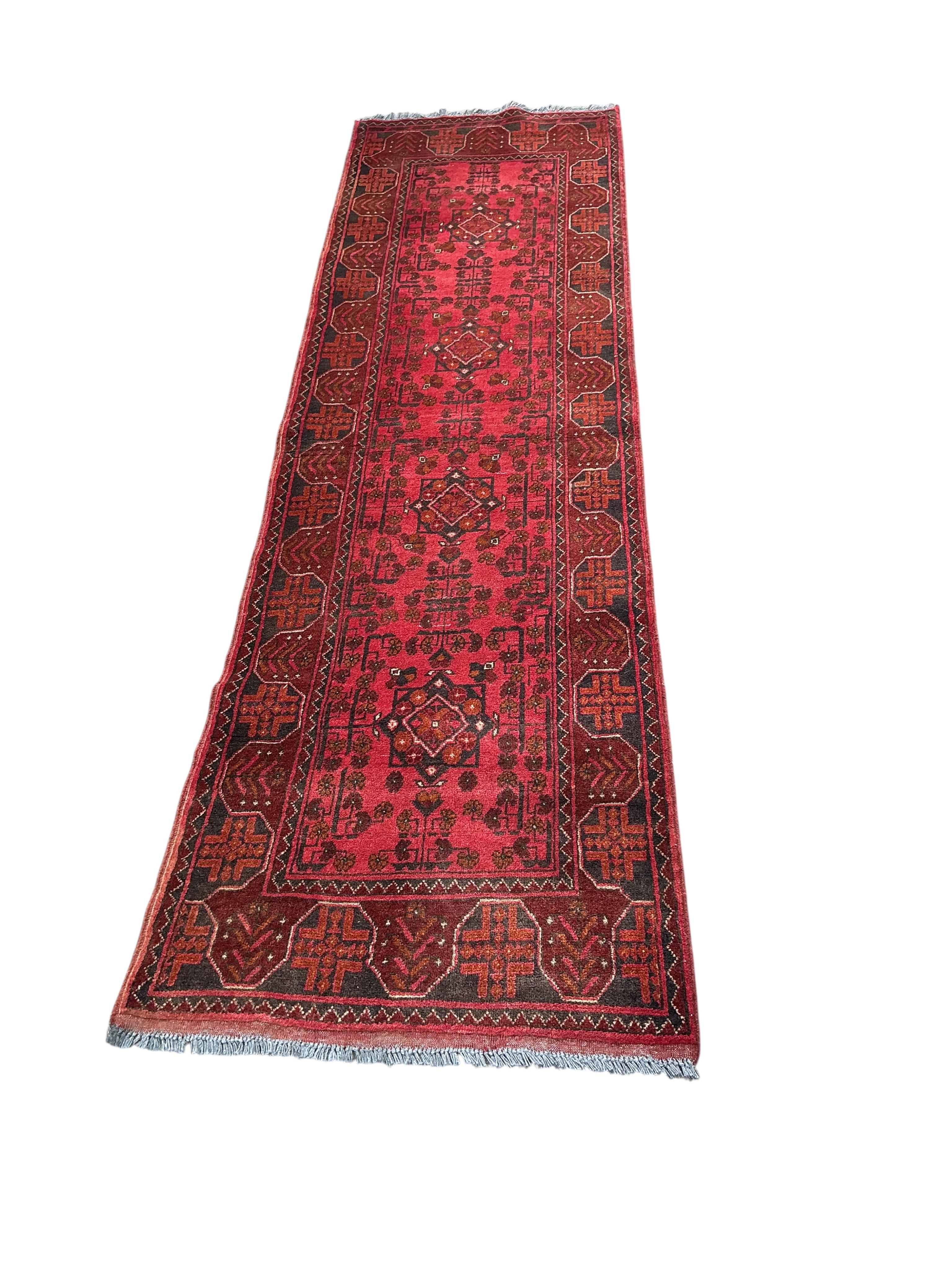 An Afghan runner, 285 x 80cm